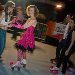Lola Staar skates with a friend and Marisa Tomei